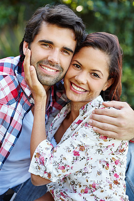 Buy stock photo A happy young couple spending time in the garden together