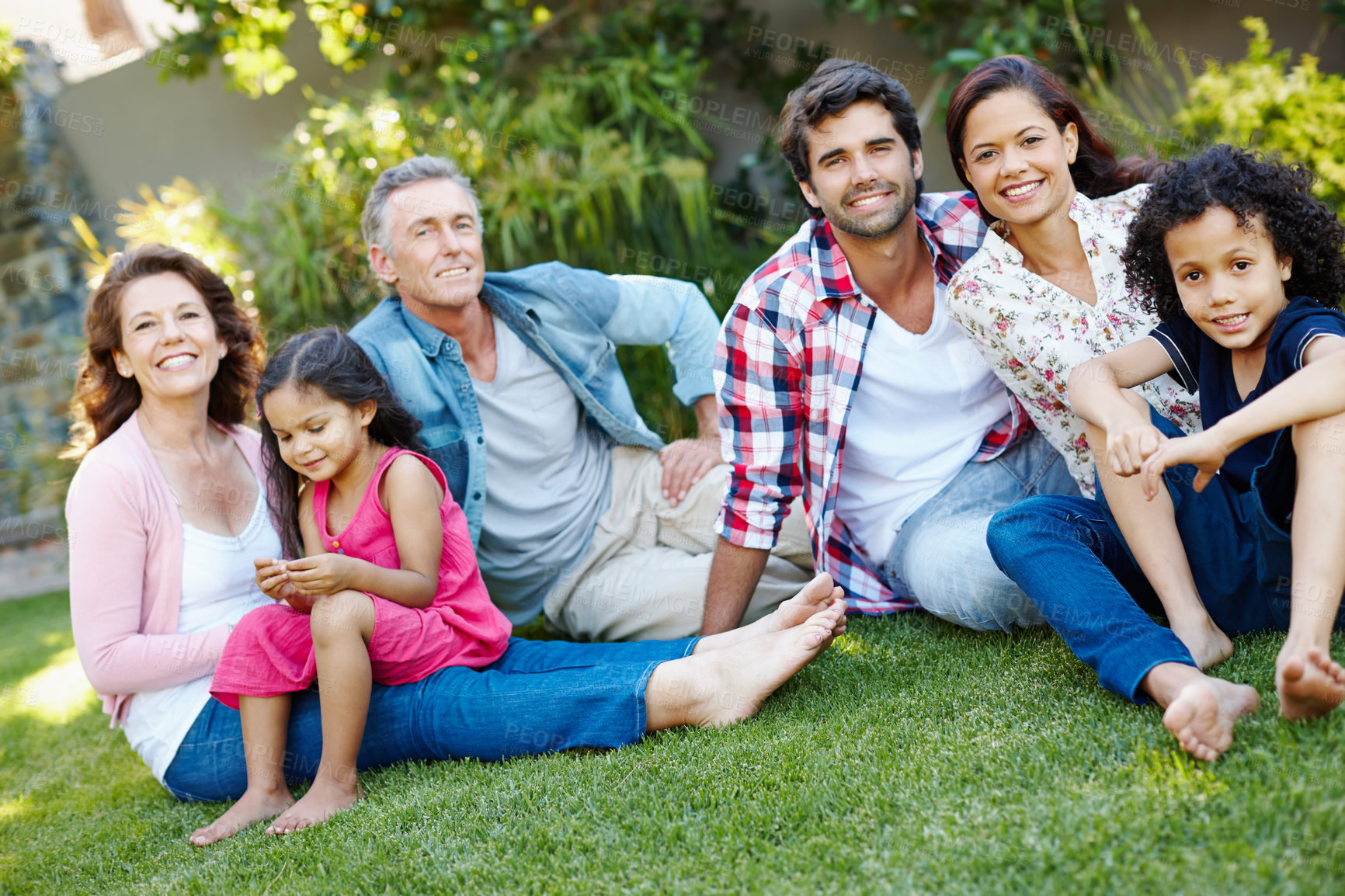 Buy stock photo Smile, nature and portrait of big family in park bonding together on outdoor vacation. Happy, interracial and children with grandparents and parents relaxing on grass in garden for holiday and love.