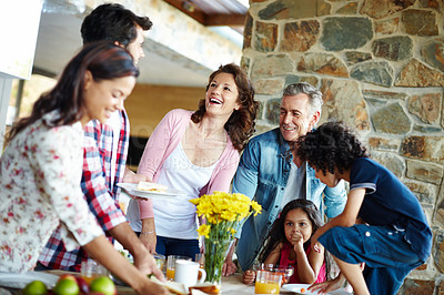 Buy stock photo A happy family enjoying a meal time together