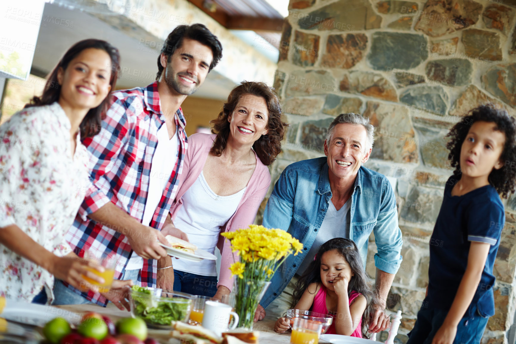 Buy stock photo A happy family enjoying a meal time together