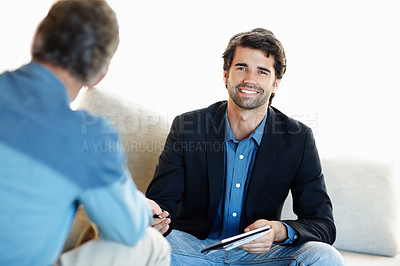 Buy stock photo Portrait, psychologist and happy man with client in office for mental health consultation meeting. Smile, therapist and person counseling patient with notebook for medical psychology, support or help