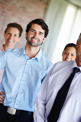 Buy stock photo Team leader, happy and man with group in portrait for about us, partnership and pride in office. Businessmen, women and together with smile for internship, recruitment and new career in company
