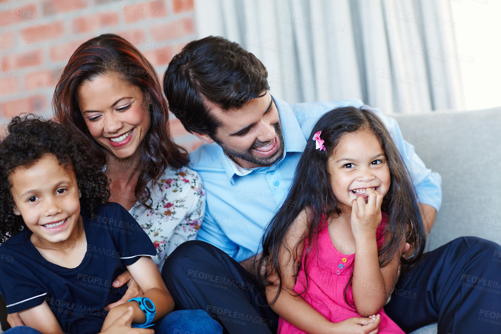 Buy stock photo A family of four enjoying quality time together
