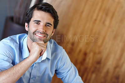 Buy stock photo Portrait of an attractive male employee with his hand on his chin