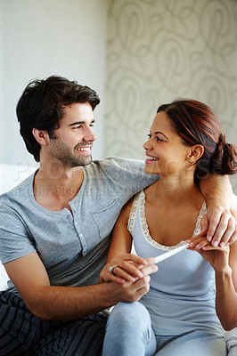 Buy stock photo Happy couple reading a pregnancy test