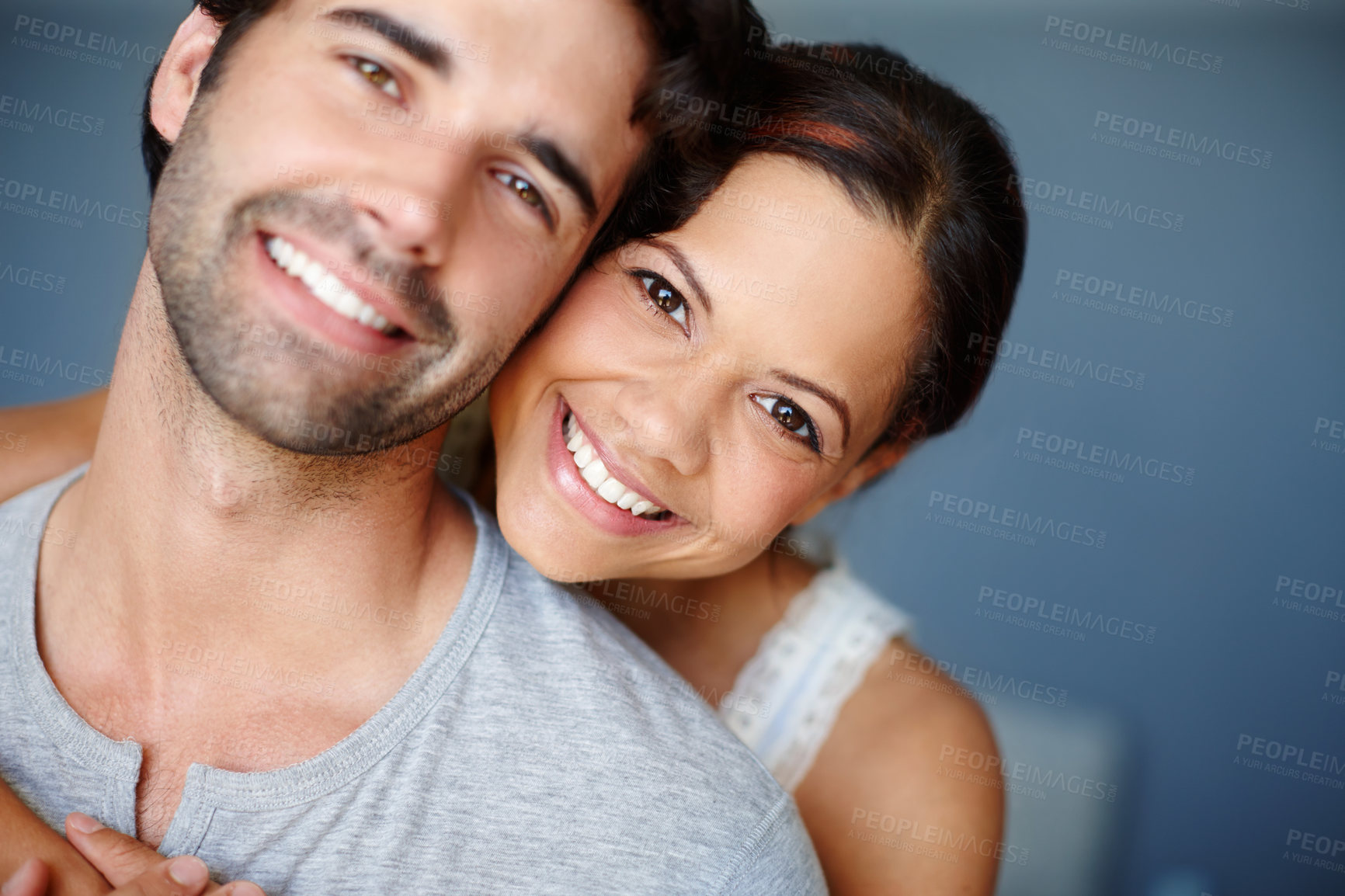 Buy stock photo Hug, portrait and love with couple in bedroom of home together for bonding, marriage or support. Face, smile or trust with happy man and woman in apartment to relax for morning or weekend time off