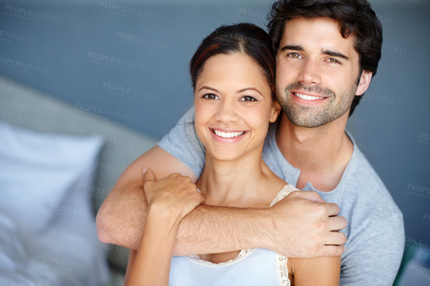 Buy stock photo Hug, portrait and trust with couple in bedroom of home together for bonding, marriage or support. Face, love or smile with happy man and woman in apartment to relax for morning or weekend time off