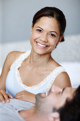 Buy stock photo Cute woman lying alongside her boyfriend in bed