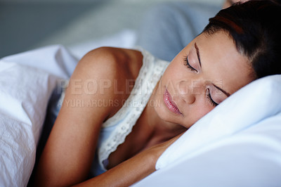 Buy stock photo Cute young couple sleeping in bed together