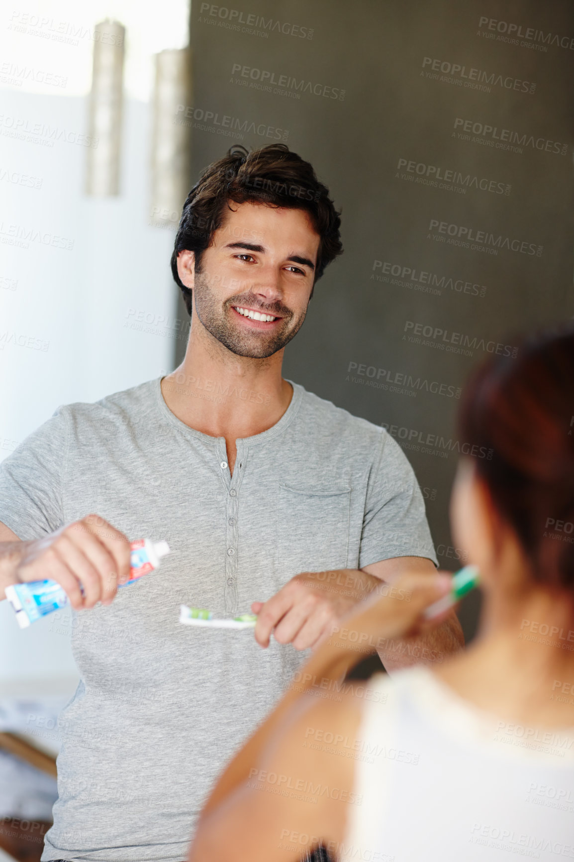 Buy stock photo Man, couple and brushing teeth in home for dental, oral hygiene and morning routine with married people. Happy, woman and toothbrush with mouth care, toothpaste and cleaning for wellness in bathroom