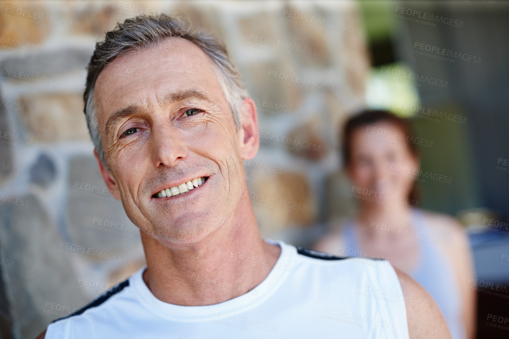 Buy stock photo Portrait, smile and training with mature couple outdoor on brick wall for fitness or running together. Cardio, workout and face of man with woman at start of daily exercise routine to improve health