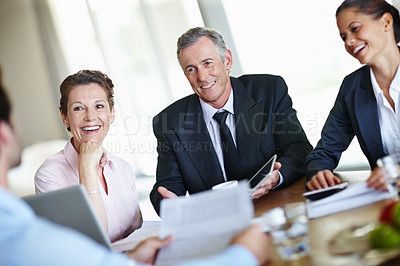 Buy stock photo A group of businesspeople having a meeting and discussing business