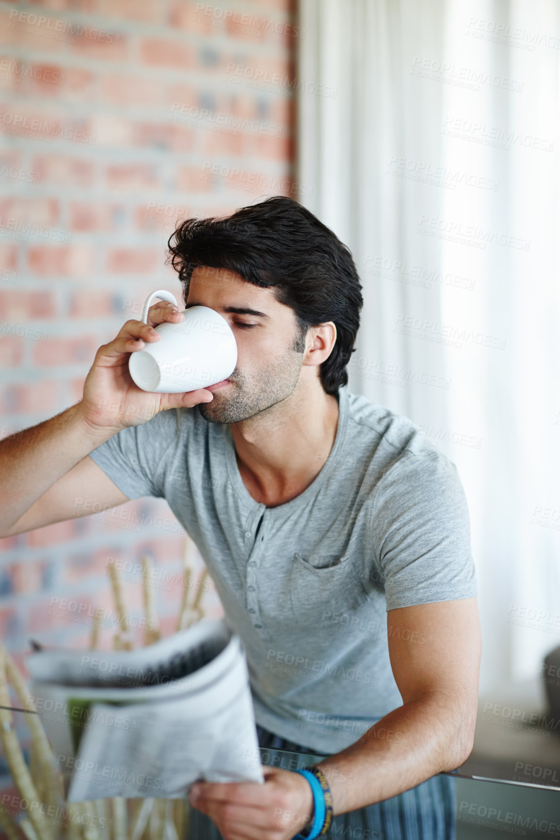 Buy stock photo Man, house and newspaper with coffee in morning for daily routine, relax and information with beverage. Drinking, tea or coco on weekend in apartment with story, article or news in paper in Germany.