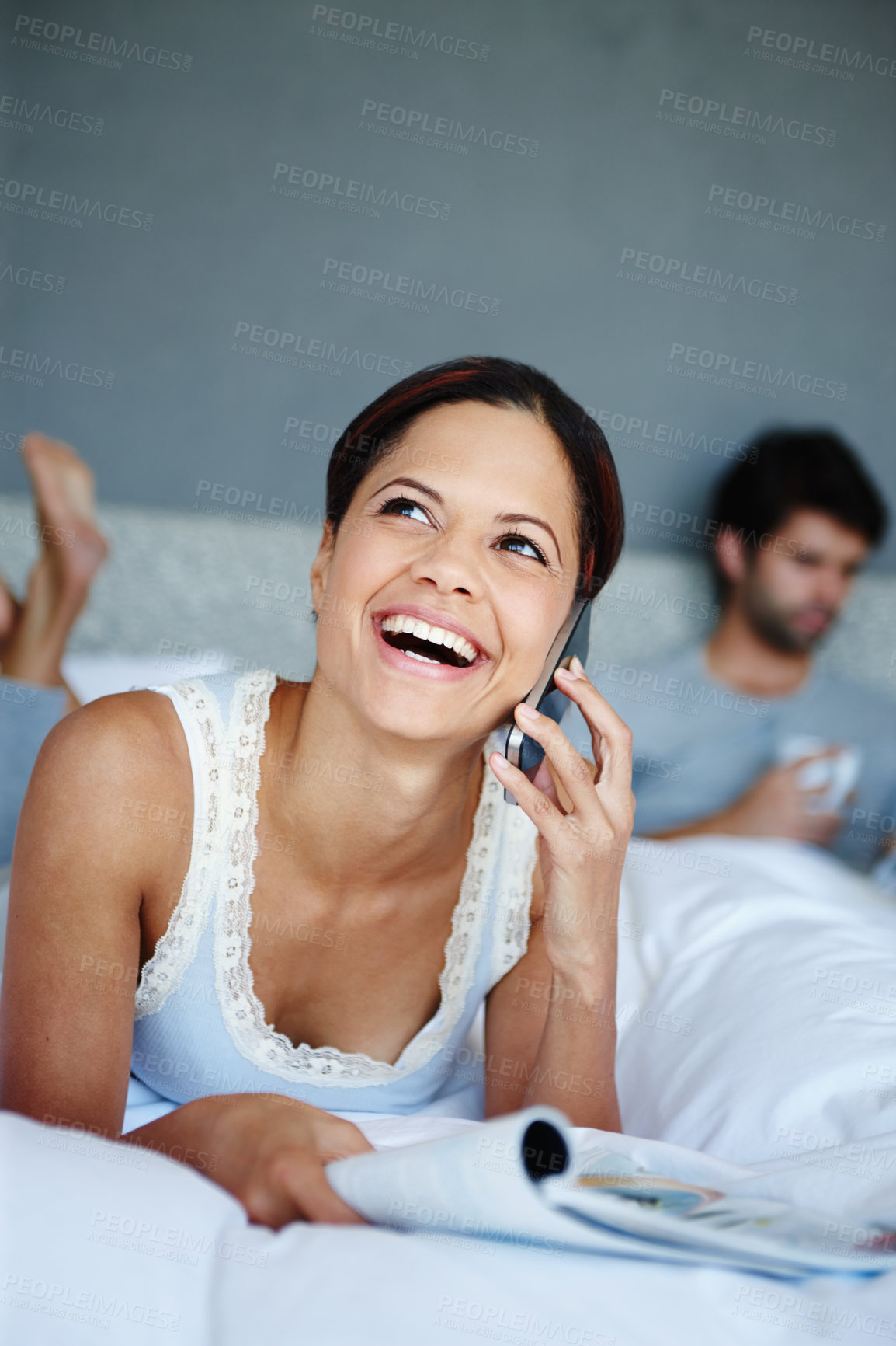 Buy stock photo Woman, happy and phone call in bedroom for morning, relax and communication or networking. Conversation, smile and female person with partner in home for discussion and meme or article in magazine