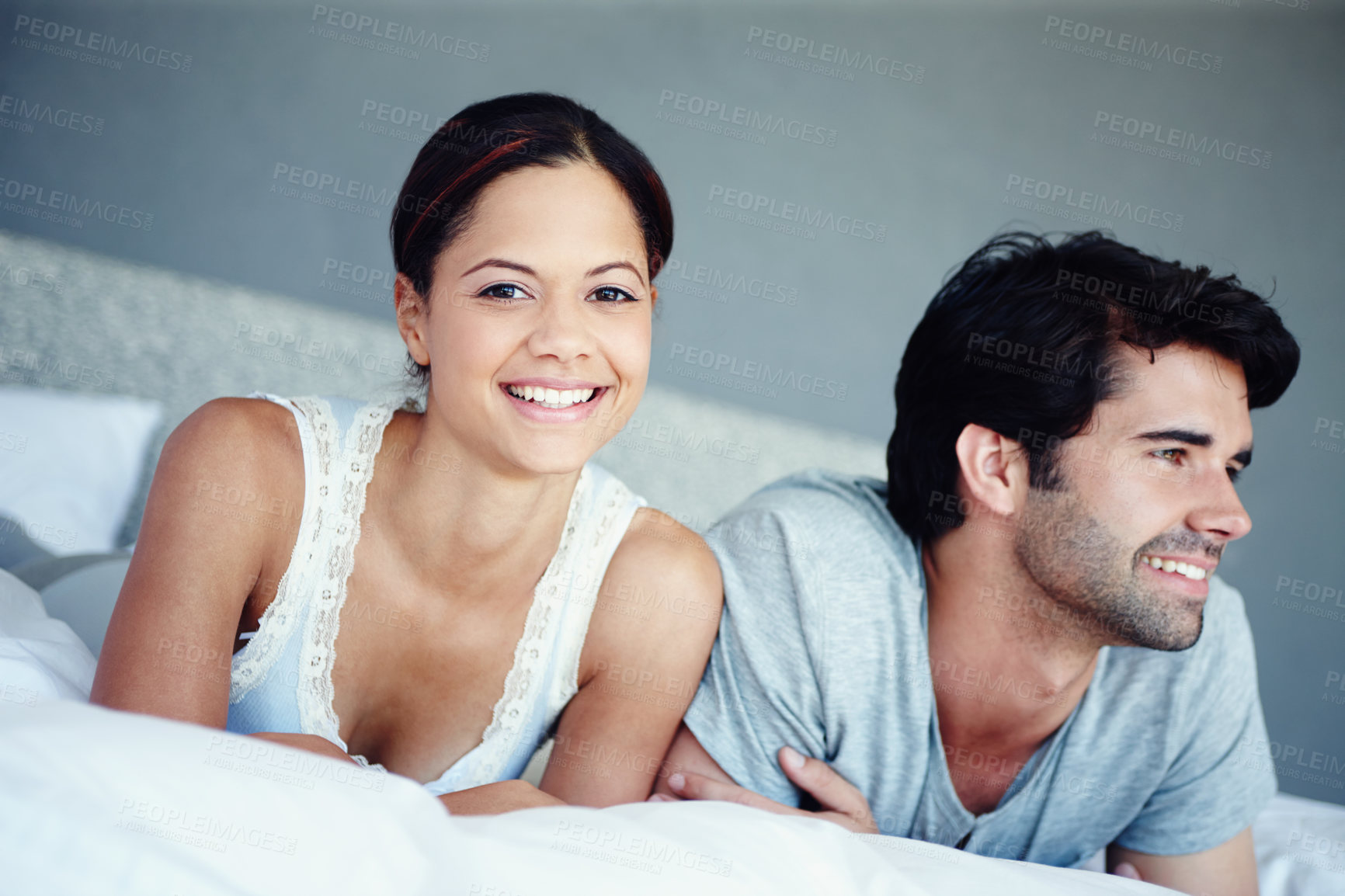 Buy stock photo Portrait, woman and man in bedroom with confidence, weekend and smile for morning bonding in home. Happy, face and couple in bed with relax, wellness and comfort in hotel room, house or apartment.