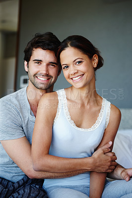 Buy stock photo Portrait of a happy couple sitting on their bed