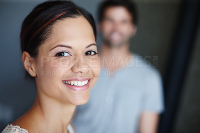 Buy stock photo Portrait of a smiling woman with her boyfriend in the background with copyspace