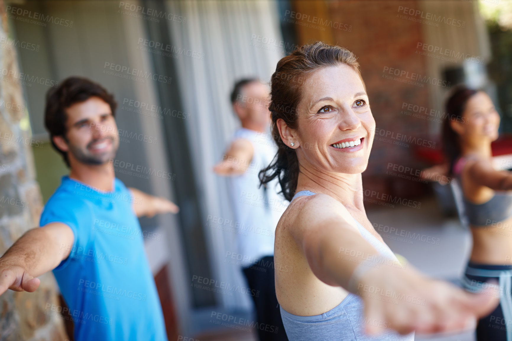 Buy stock photo Woman, pose and happy in yoga class for fitness and mental wellbeing, workout and daily lesson to coach people. Female yogini, warrior posture and yogis or students practice strength and balance. 