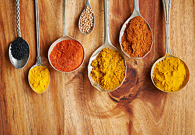 Buy stock photo Cropped shot of spoons filled with a variety of spices