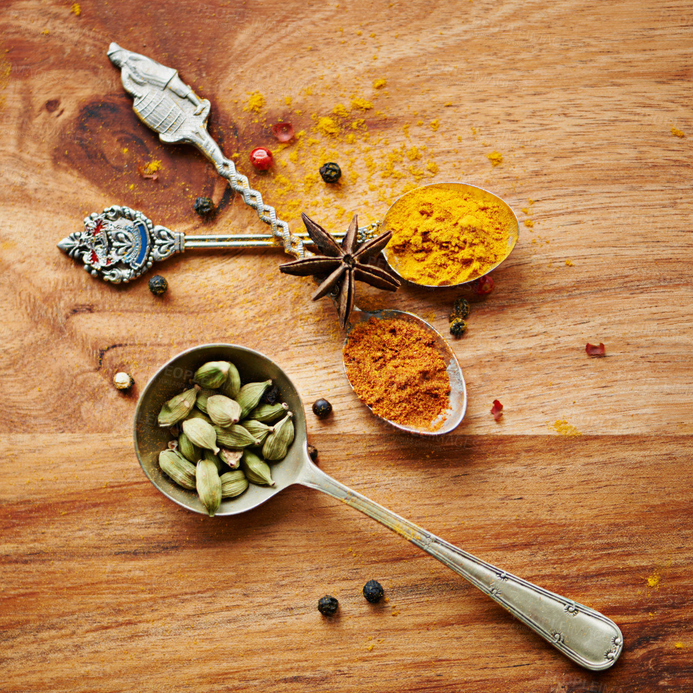 Buy stock photo Spoons, spice and selection of color for seasoning on kitchen table, turmeric and cardamom for meal. Top view, condiments and options for spicy cooking in Indian culture, nutmeg and food preparation