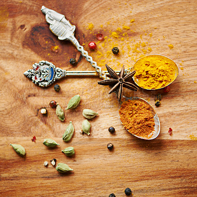 Buy stock photo Spoons, spice and selection of seasoning for diet on kitchen table, turmeric and cardamom for meal. Top view, condiments and options for spicy gourmet in Indian culture, art and food preparation