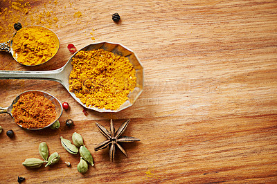 Buy stock photo Spoons, spice and selection of powder for diet on kitchen table, turmeric and cardamom for art. Top view, condiments and options for spicy cooking in Indian culture, mockup space and food preparation