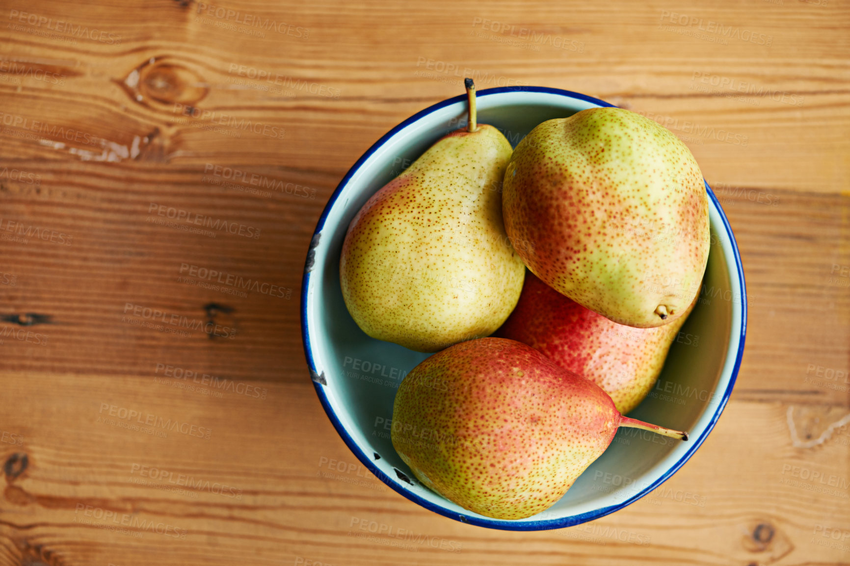 Buy stock photo Home, healthy or bowl of pears in kitchen for healthy, organic or balanced diet for nutrition, meal or snacks. Background, fiber and bunch of natural ingredients with vitamins for fruits or farming