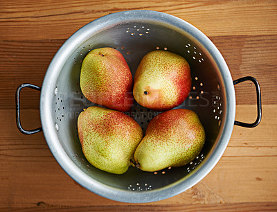 Buy stock photo Fresh, healthy or bowl pears in kitchen for fruits, organic or balanced diet for nutrition, above or snacks. Home, fiber or background of natural ingredients for vitamins, grocery sale or raw food