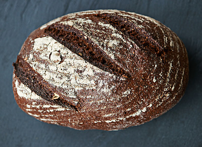 Buy stock photo Wheat, bread or bun on a bakery kitchen or table for healthy breakfast, lunch or food in restaurant. Closeup, background or fresh homemade loaf for carbohydrates or fiber or vitamins in meal or diet