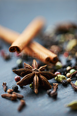 Buy stock photo Closeup of whole spices, collection of ingredients and cooking for food, fragrance and flavor with culinary background. Stick cinnamon, star anise and cloves for catering, seasoning and aroma