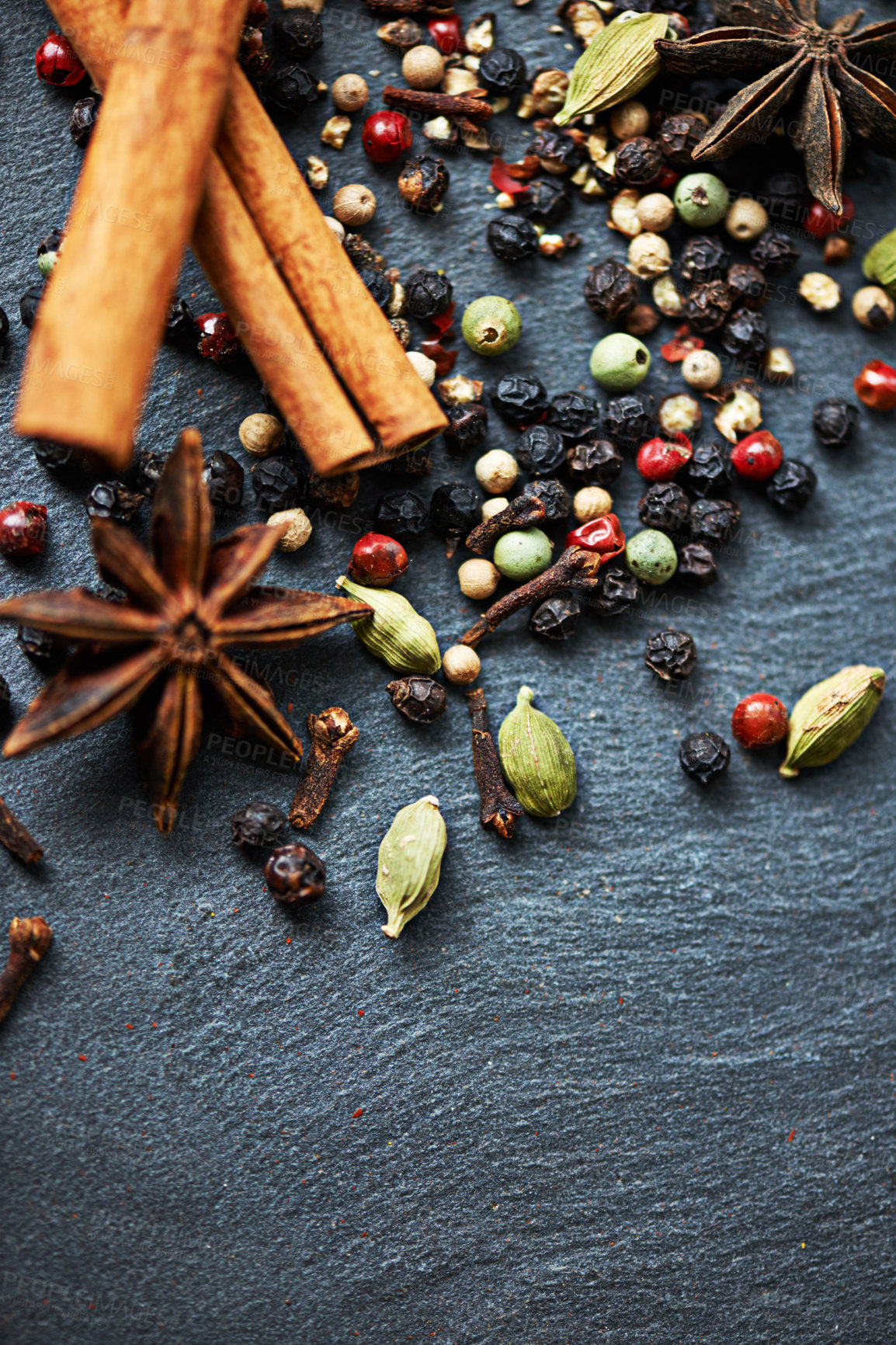 Buy stock photo Top view of whole spices, mix of ingredients and cooking for food, fragrance and flavor on kitchen counter. Stick cinnamon, star anise and peppercorn with cardamom for catering, seasoning and aroma