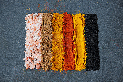 Buy stock photo Row, spice and collection of powder for seasoning, turmeric and paprika for meal. Top view, condiments and options for spicy cooking in Indian culture, cumin and food preparation on table for aroma