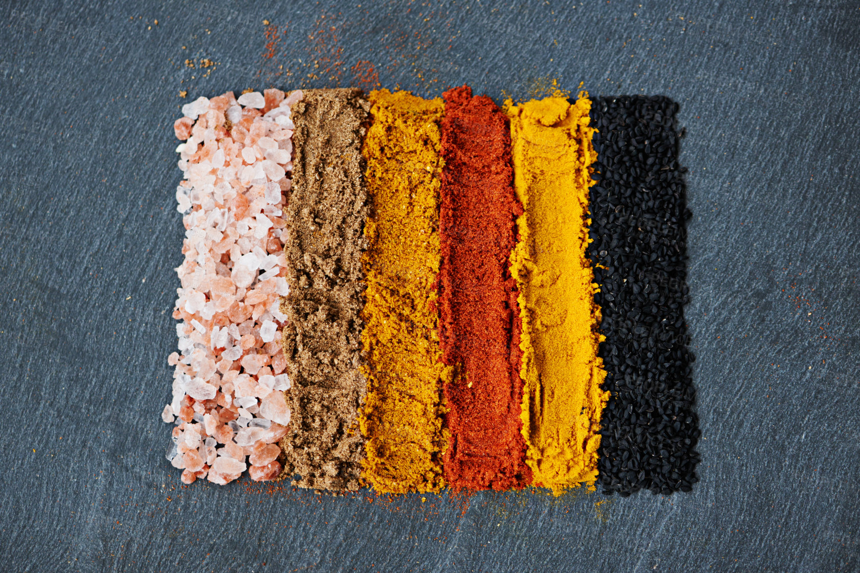 Buy stock photo Row, spice and collection of powder for seasoning, turmeric and paprika for meal. Top view, condiments and options for spicy cooking in Indian culture, cumin and food preparation on table for aroma