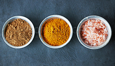 Buy stock photo Top view, spices in bowl and ingredients for food, culinary and flavor with powder or ground seasoning for cooking background. Sea salt, cinnamon and turmeric for meal and cuisine with catering