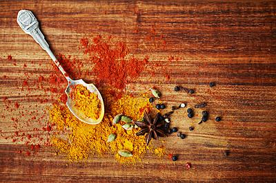 Buy stock photo Cropped shot of an assortment of colorful spices on a tabletop