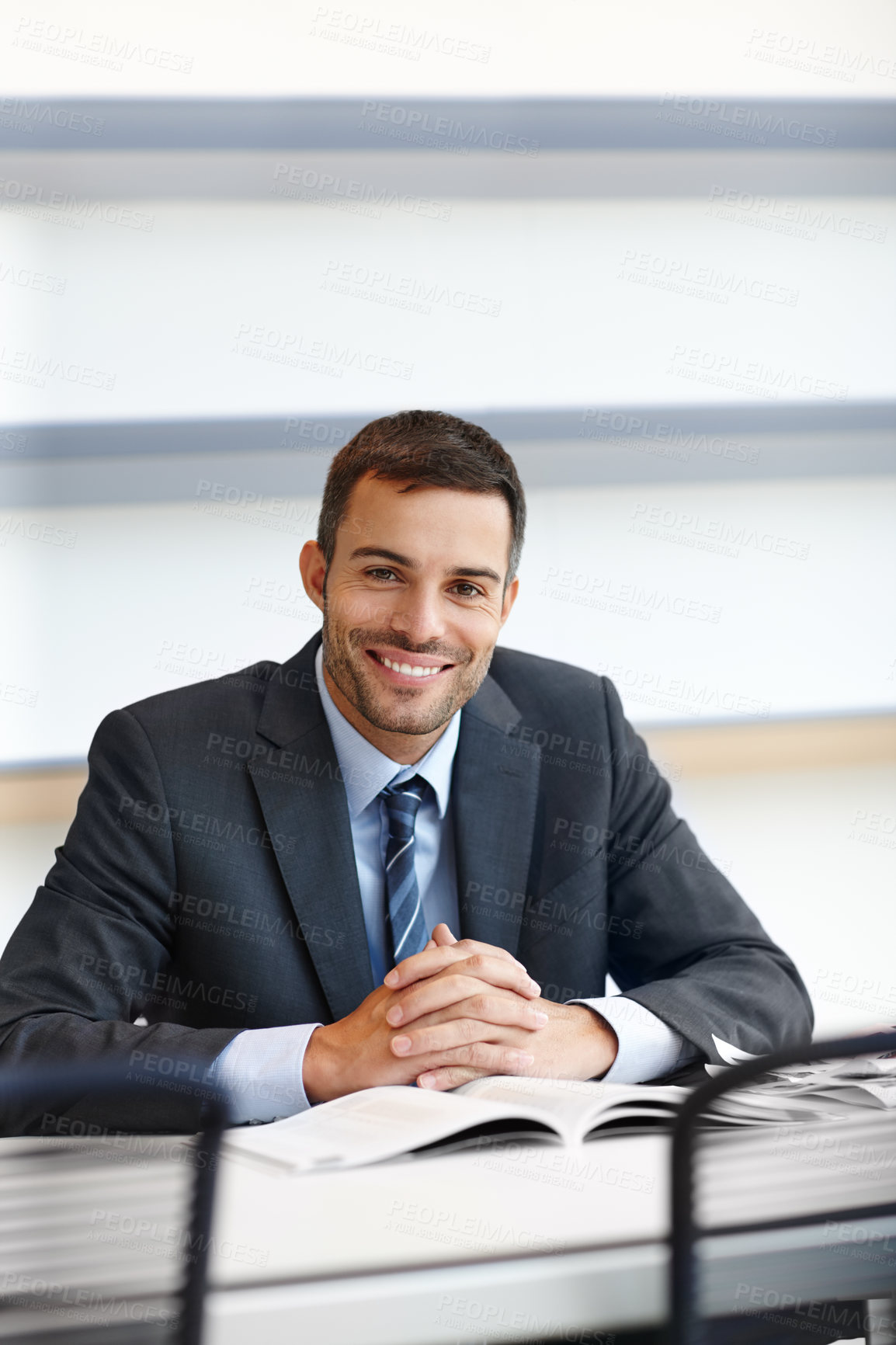 Buy stock photo Happy, businessman and paperwork in portrait for performance review, appraisal or audit in office. Smile, male person or accountant with textbook for company financial report or corporate budget plan