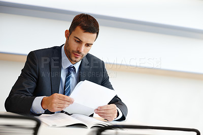 Buy stock photo Business man, reading and paperwork for financial accounting, expenses and budget report in office. Corporate worker, accountant or auditor with documents for bookkeeping of company taxes or revenue