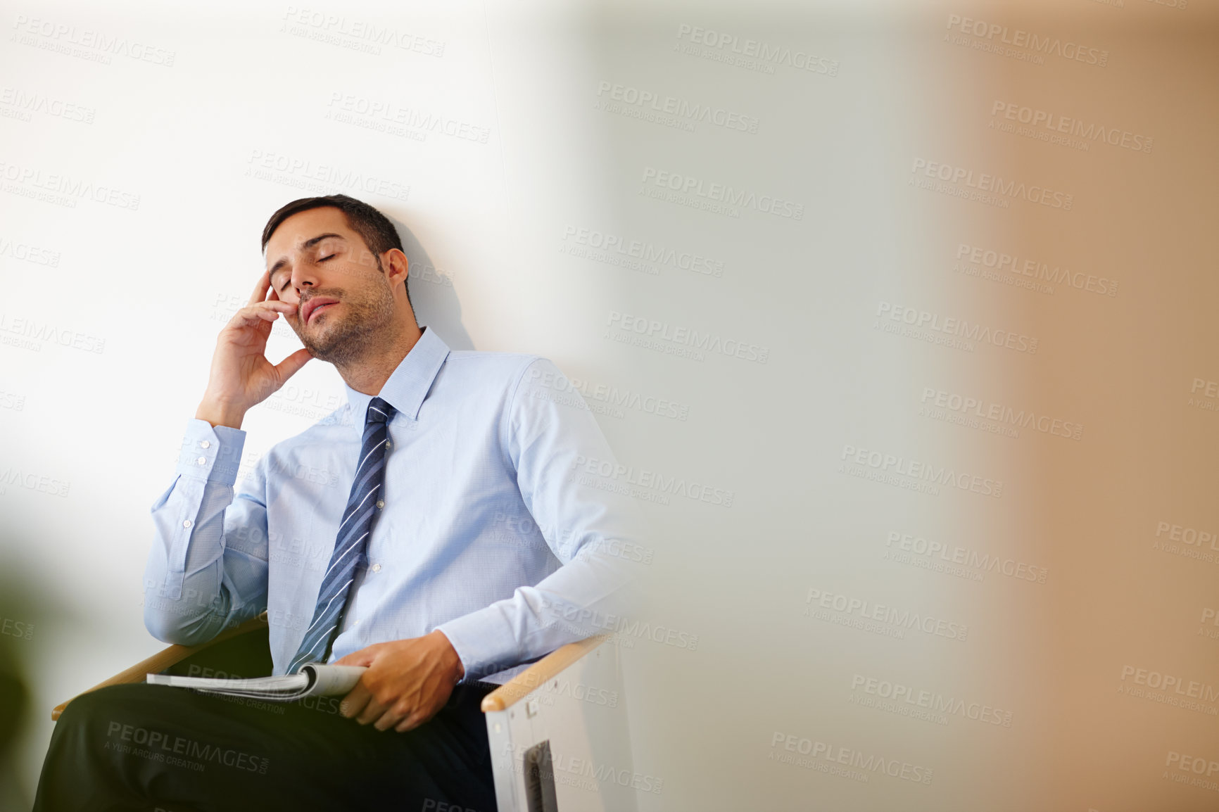 Buy stock photo Businessman, tired and magazine in waiting room with burnout for job, meeting and appointment in office. Accountant, headache and stress or mental health for stock market or economy with mockup 