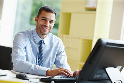 Buy stock photo Happy, businessman and typing feedback for good news or performance review with computer in office. Excited, male person or employee with tech and paperwork for email communication on company target