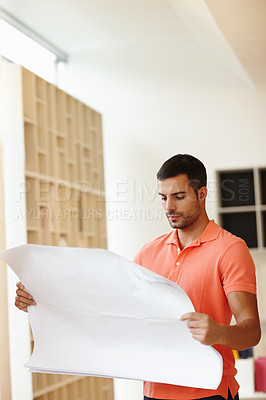 Buy stock photo Designer, architecture and man with floor plan in office for blueprint development, progress or development. Young person, contractor or worker with paper for real estate, planning and remodeling