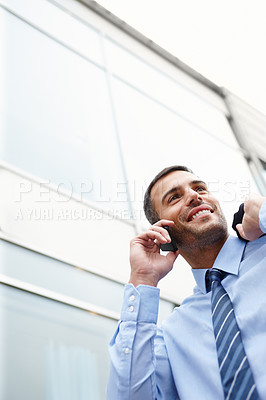 Buy stock photo Phone call, walking or happy businessman by building talking for conversation or deal communication. Outdoor, proud banker and financial advisor networking for investment, negotiation or news chat