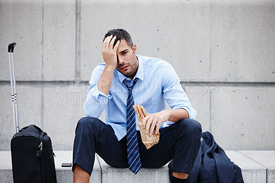 Buy stock photo Businessman, alcohol and depressed for outside, sad and job loss or fired for alcoholism. Depression, bottle or stressed person for mental break down or burnout, drink and suitcase for travel in city