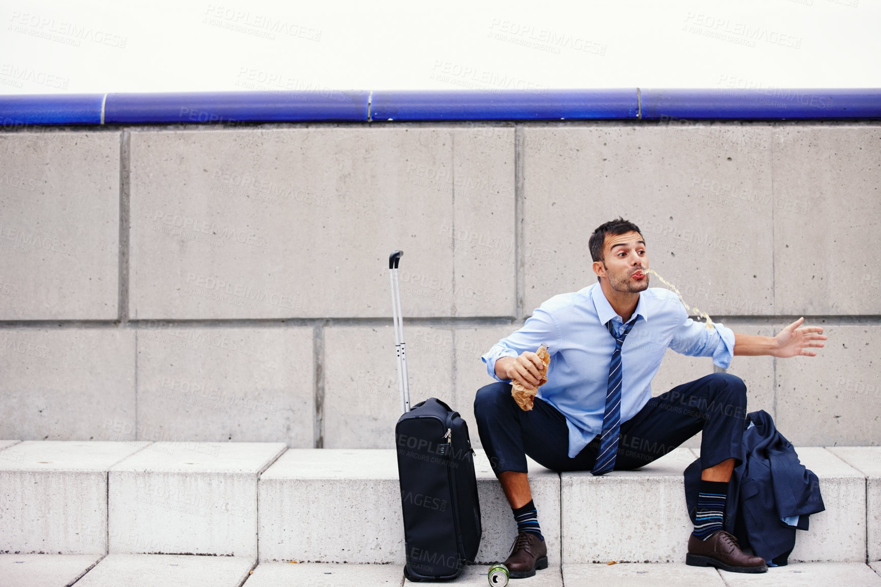 Buy stock photo Drunk, man and stairs for outside with bottle, spit and vomit for alcoholism from job loss. Suitcase, travel and fired for addiction and finance job for male person, alcohol or drink for unemployment