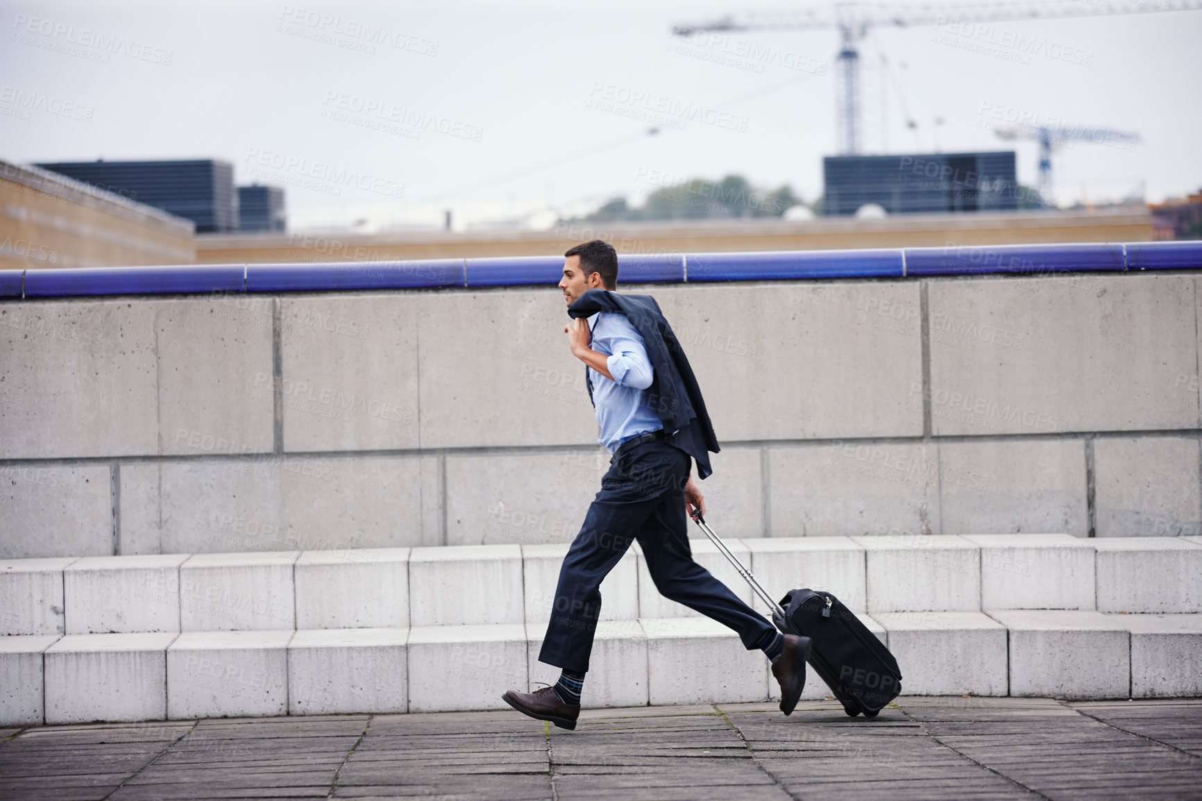 Buy stock photo Worried, business man and running late for travel or flight journey outdoor on city sidewalk. Stress, male person or employee with suitcase for rush or hurry to plane booking for work trip commute