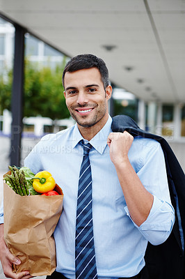 Buy stock photo Portrait, businessman and bag of groceries for nutrition, diet and wellness as professional in city. Male person, food and vegetables with smile, healthy for fridge in meal preparation or cooking