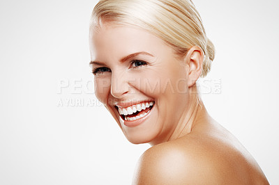 Buy stock photo Studio shot of a laughing blonde woman with copyspace