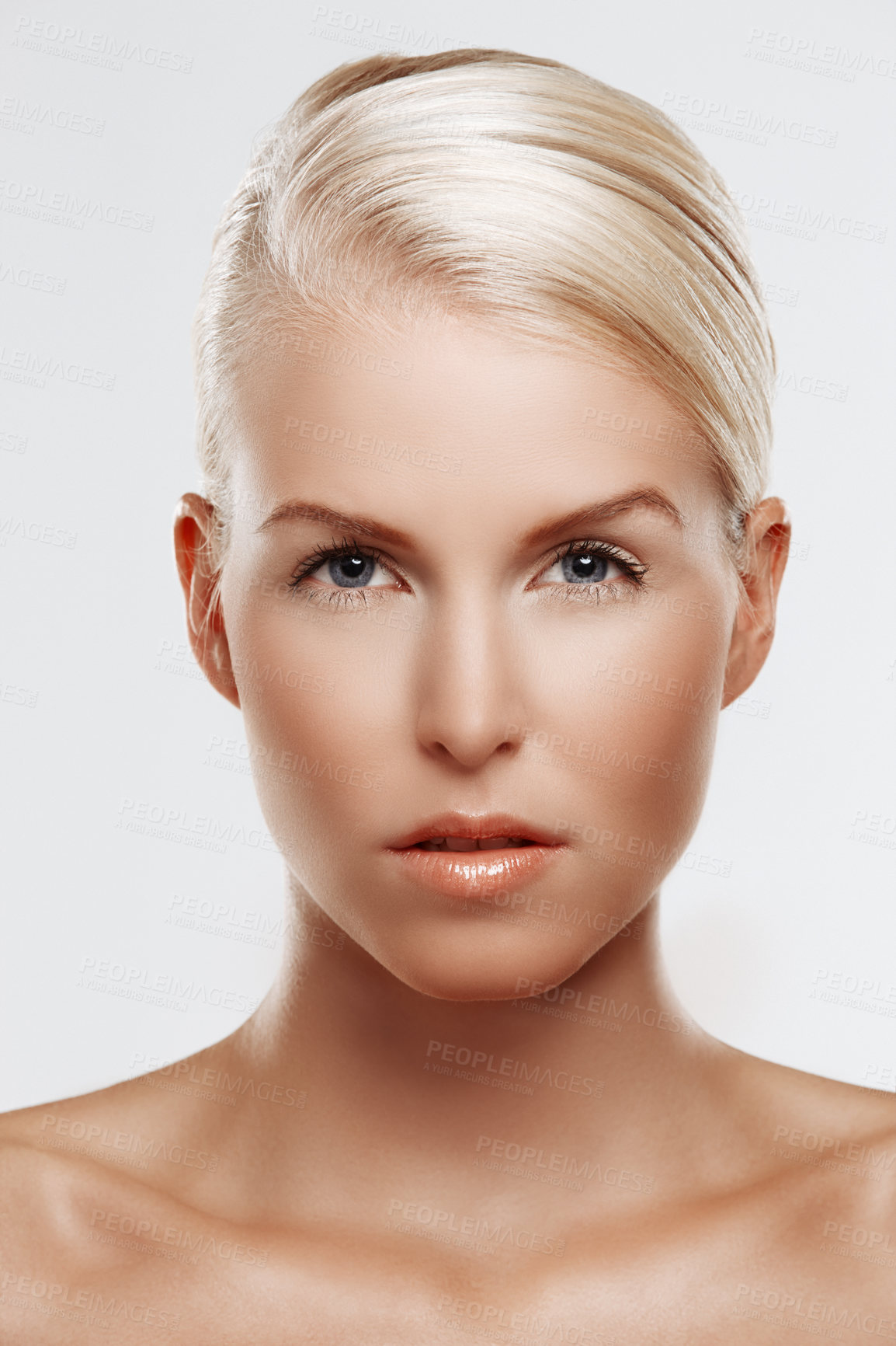 Buy stock photo Portrait, studio and serious woman with makeup for skincare, cosmetics and beauty on white background. Confident, dermatology and female person for self care with aesthetic, skin treatment and glow