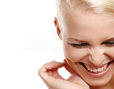 Buy stock photo Beauty shot of a young blonde woman laughing with copyspace