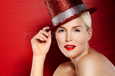 Buy stock photo Woman, portrait and lipstick with hat in studio for cosplay, fashion and beauty for mock up space. Model girl, makeup or cosmetics and pride for glamour by red background with elegance and aesthetic 