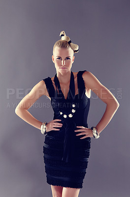 Buy stock photo A trendy fashionista posing in a black dress